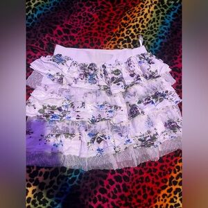 White and purple floral ruffle mini skirt with a stretchy waistband